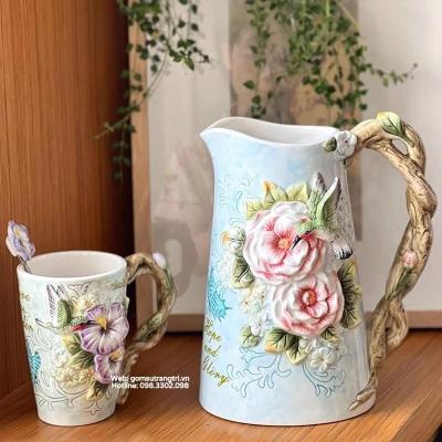BÌNH HOA BẰNG SỨ ĐẮP NỔI CHIM HOA CÓ TAY CẦM